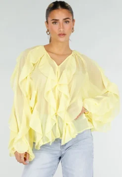 Gele Chiffon Blouse met Ruffles Lange Mouwen en Knopen
